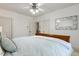Bright bedroom with a comfortable bed and view into ensuite bathroom at 209 Democracy Pl, Apex, NC 27523