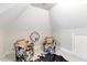 Bonus room with eclectic seating and unique design elements at 209 Democracy Pl, Apex, NC 27523