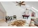 Bonus room offers a billiard table, ample seating, and natural light at 209 Democracy Pl, Apex, NC 27523