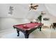 Bonus room with pool table, TV, and plenty of natural light at 209 Democracy Pl, Apex, NC 27523