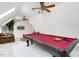 Spacious bonus room with a pool table, lounge area, and media setup at 209 Democracy Pl, Apex, NC 27523