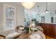 Charming dining area with rustic table, shuttered windows, and decorative chandelier at 209 Democracy Pl, Apex, NC 27523