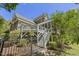 Exterior view of the home with a deck and screened porch at 209 Democracy Pl, Apex, NC 27523