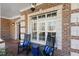 Inviting front porch with rocking chairs and stylish decor, perfect for enjoying the outdoors at 209 Democracy Pl, Apex, NC 27523