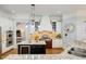 Kitchen with granite countertops, custom cabinets, stainless steel appliances, and island with wine fridge at 209 Democracy Pl, Apex, NC 27523