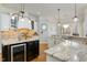 Kitchen showcases granite counters, tile backsplash, custom range hood, and stainless appliances at 209 Democracy Pl, Apex, NC 27523