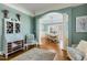 Bright living room showcasing classic architectural details, wood floors and adjacent dining area at 209 Democracy Pl, Apex, NC 27523