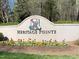 A decorative sign that says Heritage Pointe at 209 Democracy Pl, Apex, NC 27523