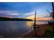 Sunset view of the lake, showcasing the tranquil waterfront scenery and the beauty of nature at 209 Democracy Pl, Apex, NC 27523