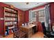 Home office featuring a wood desk, computer, bookcase and a large window for ample sunlight at 226 Riverforest Dr, Hillsborough, NC 27278