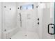 Modern bathroom featuring a spacious shower with white marble tiles, a bench, and dark bronze fixtures at 227 Beech Slope Ct, Chapel Hill, NC 27517