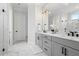 Bathroom features double sink vanity, marble floors, and modern fixtures at 227 Beech Slope Ct, Chapel Hill, NC 27517