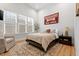 Bright bedroom with a large window, a bed, and a side table at 227 Beech Slope Ct, Chapel Hill, NC 27517