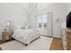 Bright bedroom with a large window, neutral decor, and a comfortable king-size bed at 227 Beech Slope Ct, Chapel Hill, NC 27517