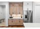 Kitchen featuring custom cabinets, stainless steel refrigerator and beverage center at 227 Beech Slope Ct, Chapel Hill, NC 27517