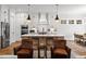 Kitchen featuring a large island, stainless steel appliances and adjacent breakfast area at 227 Beech Slope Ct, Chapel Hill, NC 27517