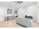 Spacious living room with a wet bar, gray cabinetry, and hardwood flooring at 227 Beech Slope Ct, Chapel Hill, NC 27517