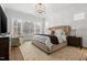 Main bedroom featuring neutral colors, decorative moldings, and natural light at 227 Beech Slope Ct, Chapel Hill, NC 27517