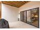 Covered patio with large sliding glass doors opening to the main house, offering seamless indoor/outdoor living at 227 Beech Slope Ct, Chapel Hill, NC 27517
