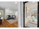 View from entry to the bright living room that features hardwood floors and neutral walls at 2305 Alabama Ave, Durham, NC 27705