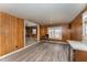 Kitchen and breakfast area with vinyl wood plank flooring and ample natural light at 241 S Plank Rd, Sanford, NC 27330