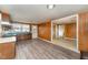 Cozy kitchen with wood cabinets, a green countertop, and wood-style flooring at 241 S Plank Rd, Sanford, NC 27330