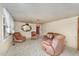 Spacious living room filled with natural light and featuring unique vintage furniture at 241 S Plank Rd, Sanford, NC 27330