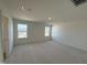 Bright bedroom with plush carpeting, large windows, and neutral walls creating a blank canvas for personalization at 2701 Princess Tree Dr, Raleigh, NC 27616