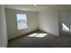 Bright, carpeted bedroom with a window and a spacious closet at 2701 Princess Tree Dr, Raleigh, NC 27616