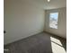 Bright bedroom featuring neutral carpeting and a window providing natural light for a cozy and inviting space at 2701 Princess Tree Dr, Raleigh, NC 27616