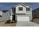 Charming two-story home featuring a two-car garage, beautiful landscaping, and modern architectural details at 2701 Princess Tree Dr, Raleigh, NC 27616