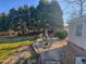 Private backyard features a patio with outdoor dining set, perfect for entertaining and enjoying the outdoors at 2940 Bramblegate Dr, Mebane, NC 27302