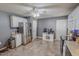 The spacious kitchen features stainless steel appliances, tile flooring, and white cabinets at 2940 Bramblegate Dr, Mebane, NC 27302