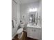 A serene bathroom offers modern fixtures, a mirror, and soft lighting, creating a relaxing space at 3 Azzi Ct, Durham, NC 27703
