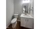 This half-bath is clean with modern fixtures, including a streamlined vanity and contemporary mirror at 3 Azzi Ct, Durham, NC 27703