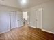 Bedroom features wood-look flooring, two closets, and natural light at 3 Azzi Ct, Durham, NC 27703
