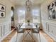 A dining room featuring contemporary decor and light fixtures and natural light at 3 Azzi Ct, Durham, NC 27703