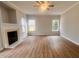 A living room with a fireplace, neutral walls and flooring, and bright natural light at 3 Azzi Ct, Durham, NC 27703