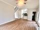 An open living room with stairway and kitchen in background at 3 Azzi Ct, Durham, NC 27703
