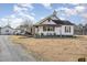 Charming home featuring a covered front porch and spacious front yard at 3158 Us Highway 70 Bus E, Smithfield, NC 27577