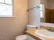 Bathroom with tile countertop, single sink, and a window at 3553 E Jameson Rd, Raleigh, NC 27604