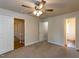 Large bedroom with multiple doorways and neutral carpet at 3553 E Jameson Rd, Raleigh, NC 27604