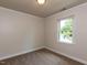 Bedroom featuring neutral walls, carpet and trim, with view to the outside at 3553 E Jameson Rd, Raleigh, NC 27604
