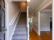 Bright foyer featuring staircase with natural light and hardwood floors at 3553 E Jameson Rd, Raleigh, NC 27604