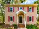 Charming two-story home with red shutters and inviting front porch at 3553 E Jameson Rd, Raleigh, NC 27604