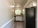 Bright kitchen with updated appliances and gray tile backsplash at 3553 E Jameson Rd, Raleigh, NC 27604