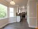 Well-lit kitchen with stainless steel appliances and view of the backyard at 3553 E Jameson Rd, Raleigh, NC 27604