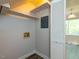 Functional laundry room with shelving and natural light at 3553 E Jameson Rd, Raleigh, NC 27604