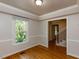 Living room area showcasing hardwood floors, natural light, and neutral paint at 3553 E Jameson Rd, Raleigh, NC 27604