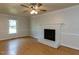 Comfortable living room featuring fireplace, and a window bringing in natural light at 3553 E Jameson Rd, Raleigh, NC 27604